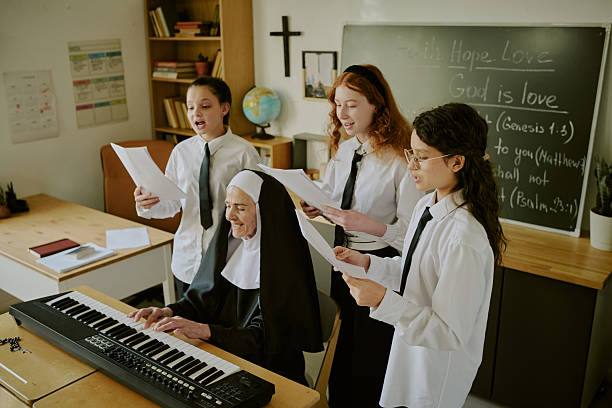 istock Choir Group Singing Together with Elderly Nun 2215942924