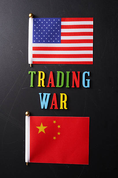 istock single word trading war and American and Chinese flag background 2215944110