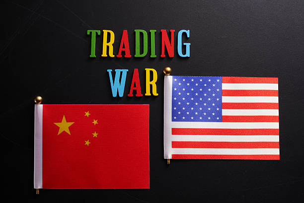 istock single word trading war and American and Chinese flag background 2215944140