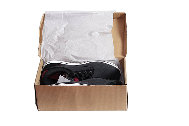 Sports shoes in packaging. Close-up. Isolated on white background.
