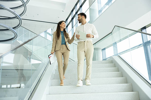istock Engaging Conversation in Corporate Stairwell 2215944656