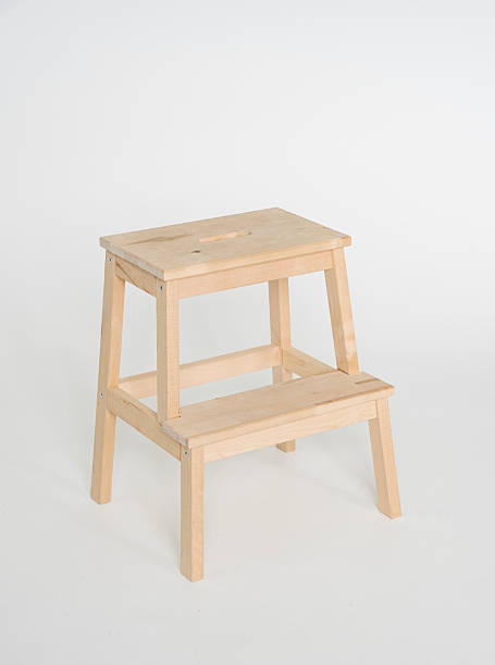 istock step ladder made of unpainted wood, on white background, copy space 2215944814
