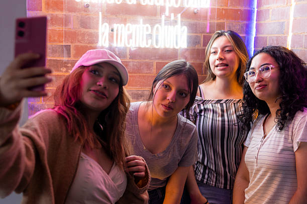 istock Friends gathers to take a selfie indoors 2215947309
