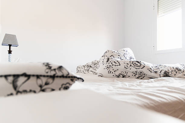 istock Bed unmade in the morning light 2215949107