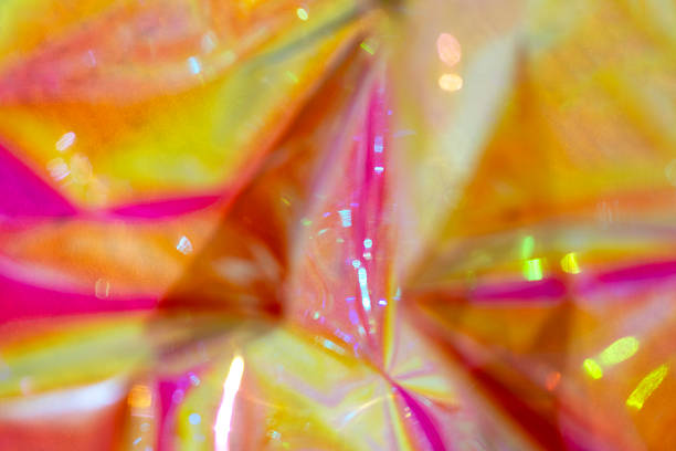 Vivid pink, yellow, and orange patterns reminiscent of iridescent light effects.