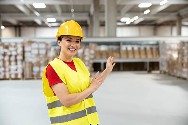 Smiling Worker in Safety Gear at Warehouse