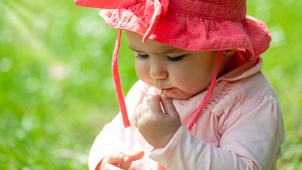 Baby enjoying the spring/summer season. Copy space