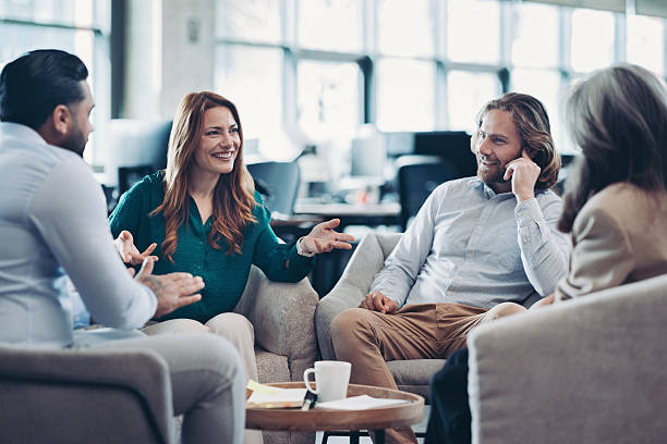 istock Business people working together in an open office space 2215951478