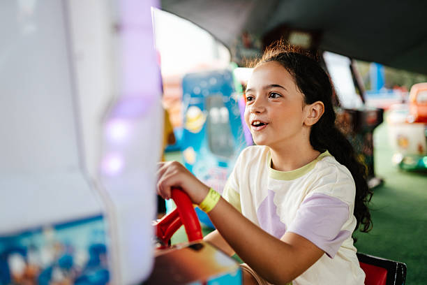 Girl enjoying arcade driving game