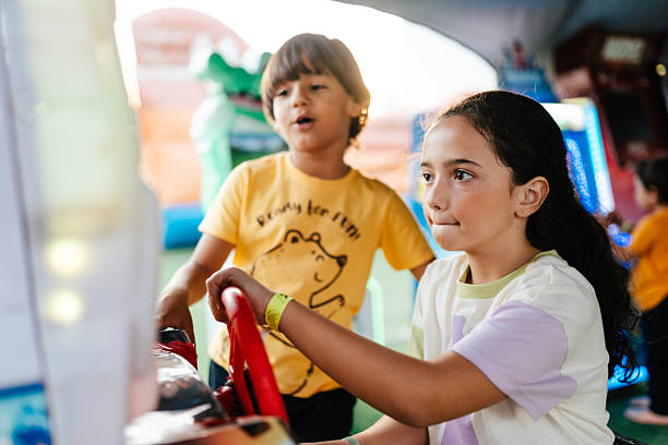 Boy standing beside girl at arcade event