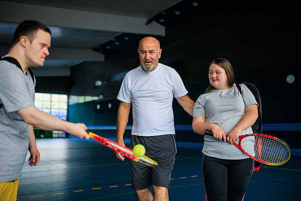 istock Inclusive Tennis Training with Coach and Athletes with Down Syndrome 2215954892