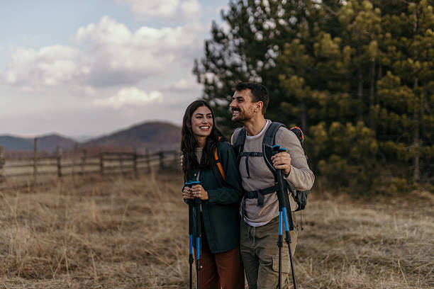 istock Happy hikers enjoying a walk in nature 2215955464