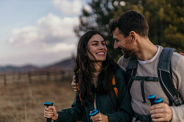 Happy hikers smiling and enjoying mountain scenery