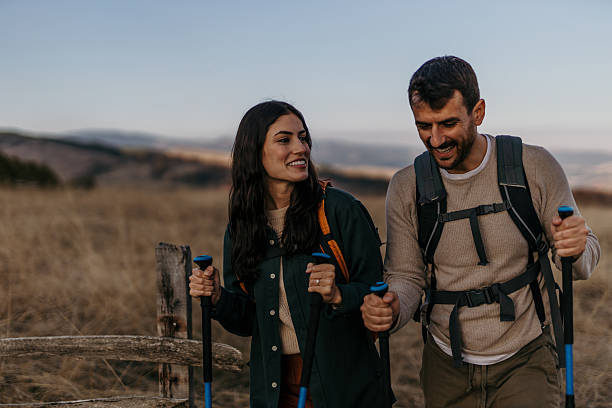 istock Hikers walking and smiling in the countryside 2215955492