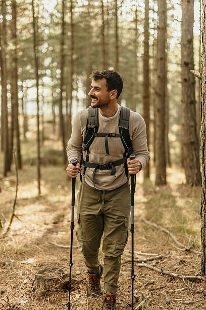 istock Young male hiker enjoying a walk in the woods 2215955802