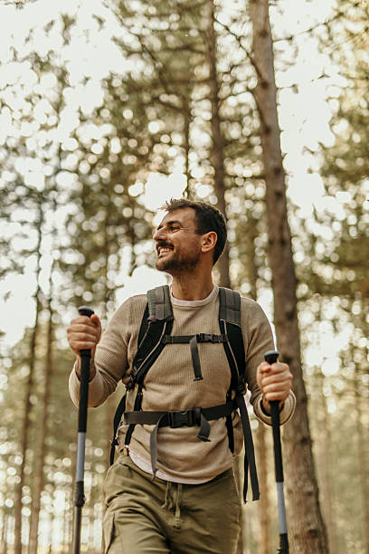 istock Happy hiker is enjoying a hike in the woods 2215955854