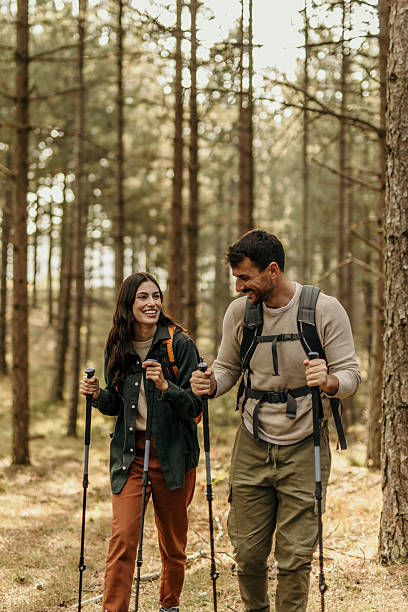 istock Young couple enjoying a hike in a forest 2215955892