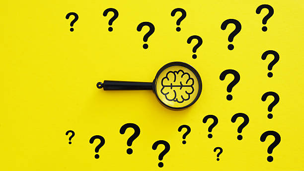 istock Education, creative idea and innovation are shown by magnifying glass with light brain and question mark symbols 2215957232