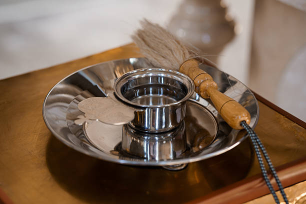istock A still life composition depicting a silver incense burner and a feather duster resting on a polished wooden surface in a religious setting 2215958464