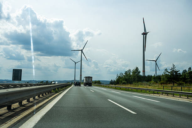 the road goes forward towards the wind farms