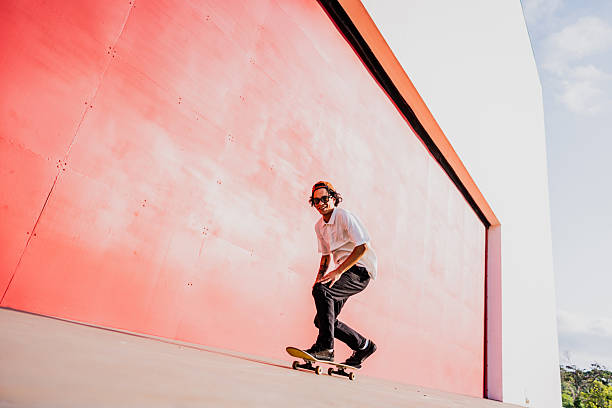 istock Young man riding a skateboard outdoors 2215962235