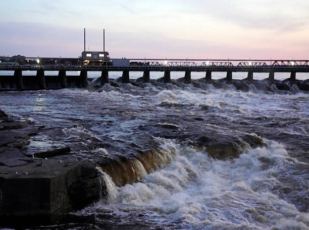 istock Wide dam with rushing water through it at dusk 2215968564