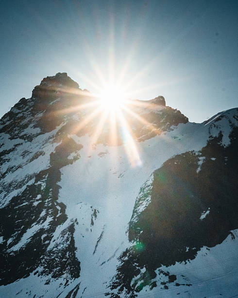 A serene view of Mount Vallunaraju in Peru, captures the majesty of this iconic peak at sunrise. Ideal for promoting outdoor adventures, nature conservation. glow of the morning sky