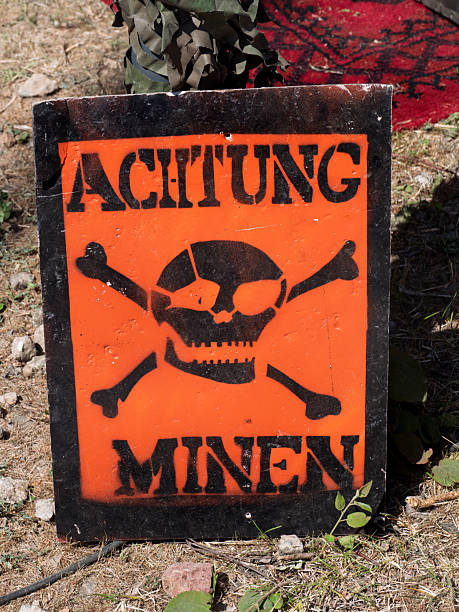 istock Danger Sign Warning of Land Mines in German 2215972190