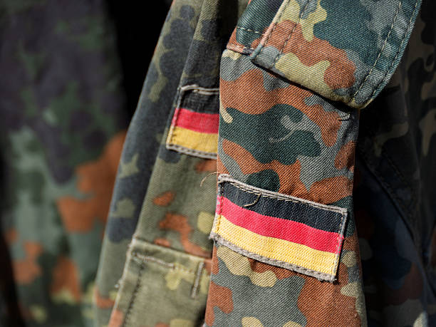 istock German Military Camouflage Uniform with National Flag 2215972220