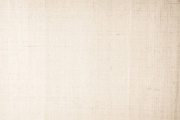 istock Brown sackcloth woven texture background in natural pattern. Jute hessian burlap, linen background in light beige cream color blank. Weaving canvas fiber line cotton cloth textured as organic. 2215980879