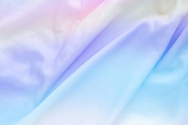 istock Abstract colorful rainbow color fabric soft wave smooth texture surface background 2215980938