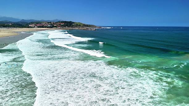 istock A Beautiful Beach with Serene Waves Gently Lapping Against the Soft Sand and Clear Skies 2215983392