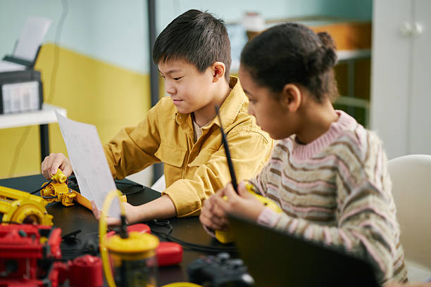 istock Children Engaging in Science Experiment in Classroom 2215990061