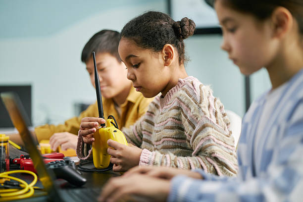 istock Kids Engaging in STEM Activities with Gadgets in Classroom 2215990065
