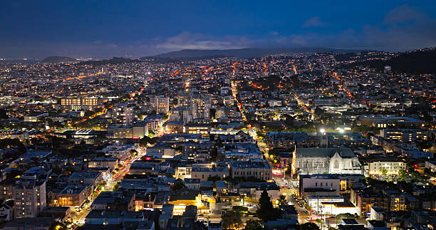 Drone shot of San Francisco, CA, looking south at twilight from Pacific Heights towards Japantown, the Fillmore District, and the Lower Haight in the distance.