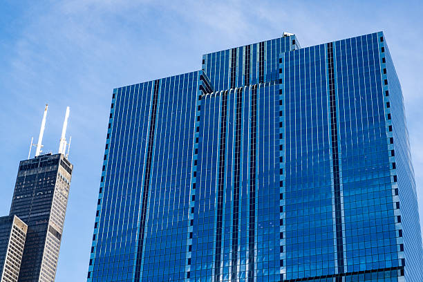 istock office building in business district. skyscraper building architecture. skyscraper with glassy facade. multistory modern glass building. skyscraper in metropolis city. city downtown with skyscraper 2215992457