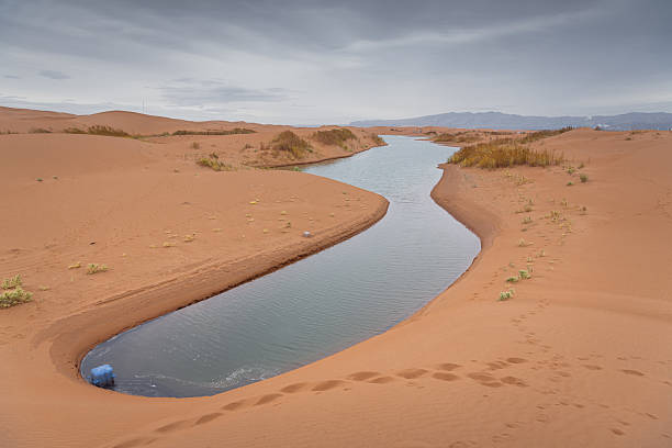 istock Big dune and the sand texture with the river cutting through at foreground, Inner Mongolia, China 2215993518