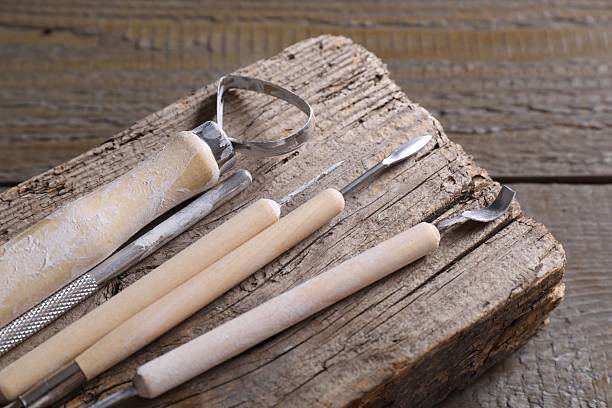 istock Set of different clay crafting tools on wooden table, closeup 2215996052