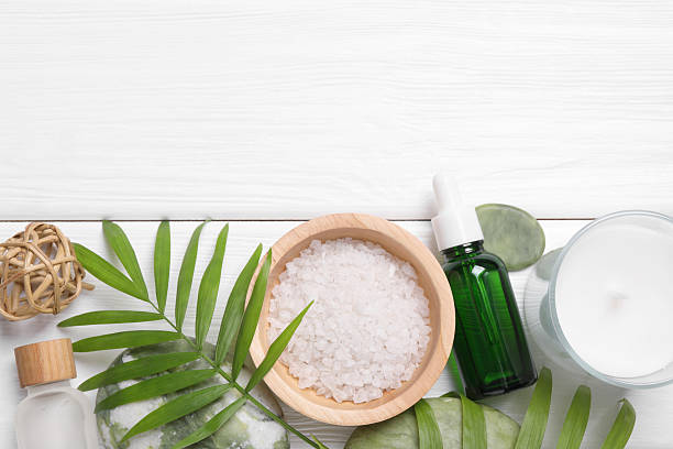 istock Flat lay composition with candle and different spa products on white wooden table. Space for text 2215996430