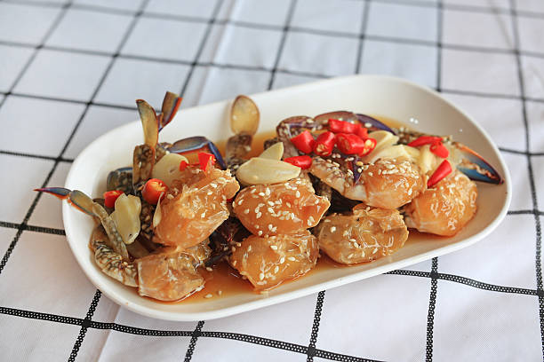 istock Korean pickled crab sauce in white plate on table. Soy Sauce Marinated Crab. 2215997770