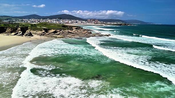 istock Experience a Stunning Coastal View with Turquoise Waters and a Vibrant Cityscape 2215998716