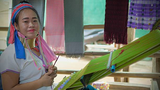 Karen Long Neck wearing traditional brass rings in hill tribe village market in Mae Hong Son, Kayan ( Paduang) village. December 15 2024, Mae Hong Son, Thailand : Karen Long Neck wearing traditional brass rings in hill tribe village market in Mae Hong Son, Kayan ( Paduang) village. kayan neck rings stock pictures, royalty-free photos & images