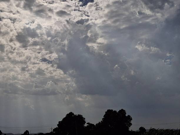 The clear blue sky forms an expansive canvas, decorated with delicate cirrus clouds stretching across the horizon