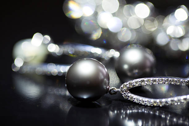 Beautiful bijouterie. Stylish earrings on black background