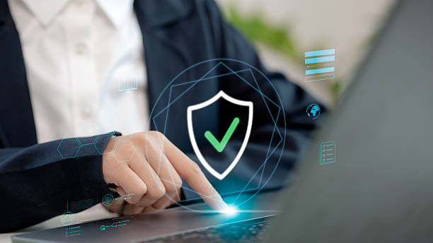 istock Businesswoman touching a virtual security shield with checkmark icon, symbolizing cybersecurity, data protection, secure login, and digital authentication for online safety. 2216006654