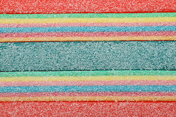 Gummy candies all over background, close up.