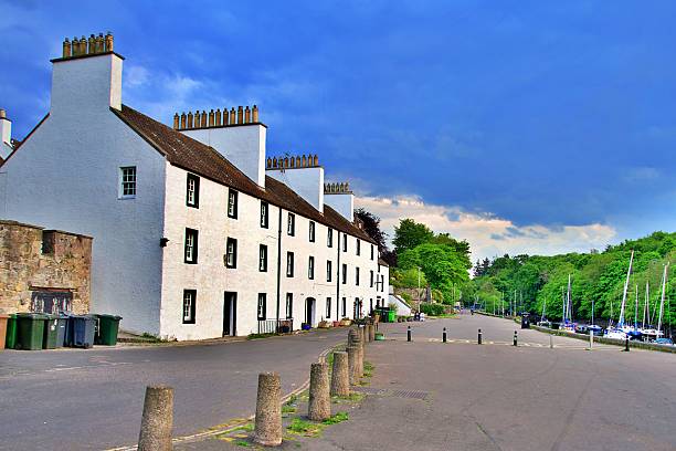 istock Traditional white buildings by a marina and park. 2216010970