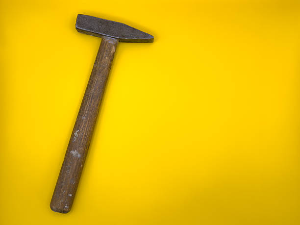 hammer hitting hard on a nail
