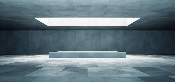 istock Modern empty concrete room interior with podium and natural skylight 2216012155