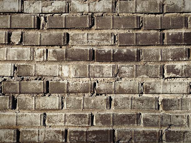 Stone brick wall background. brown brick wall, dark background for the design.